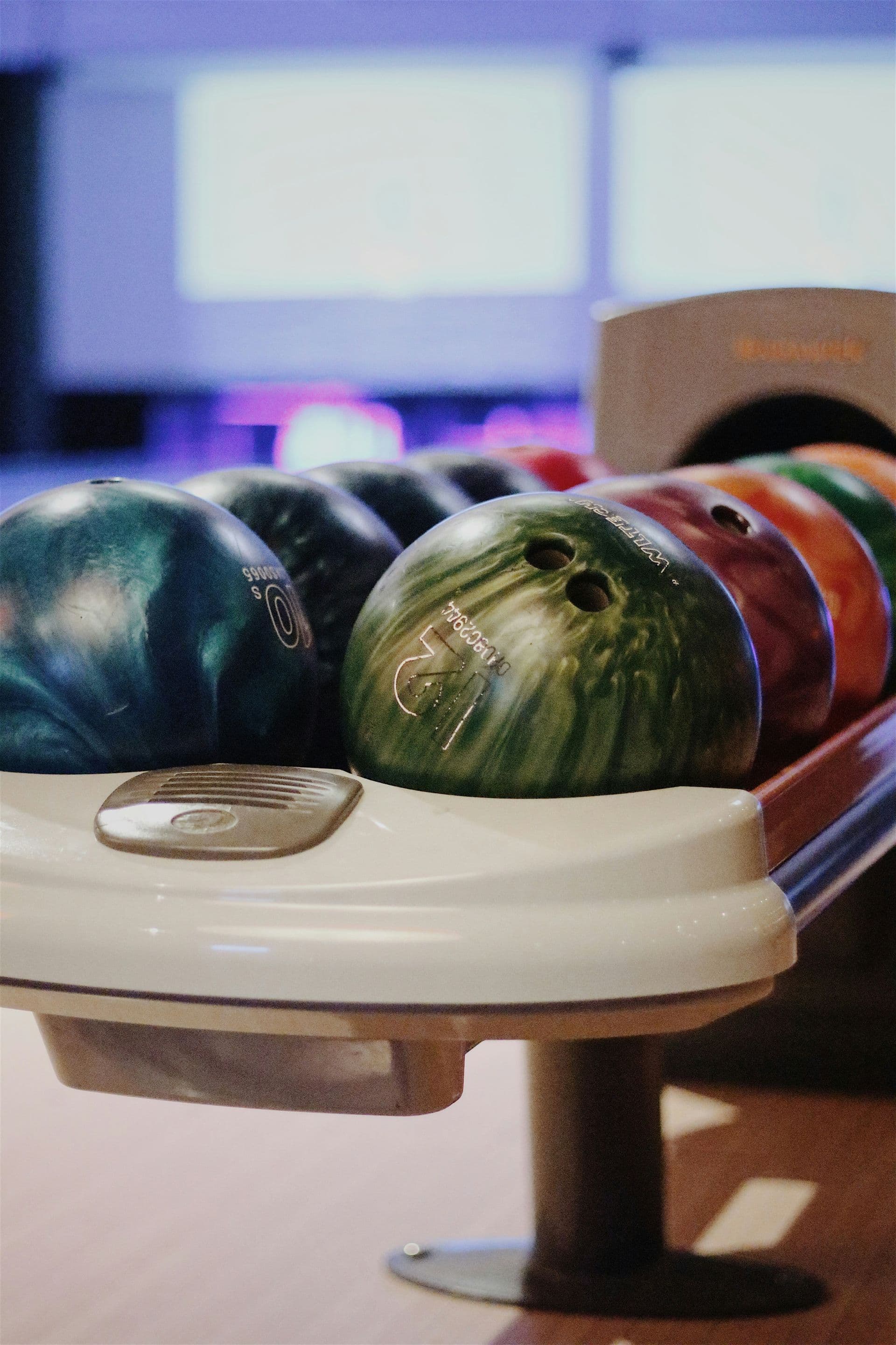 Bowling ball rolling back on the return rail