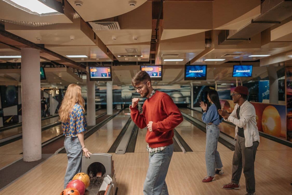 Friends celebrating at the bowling alley