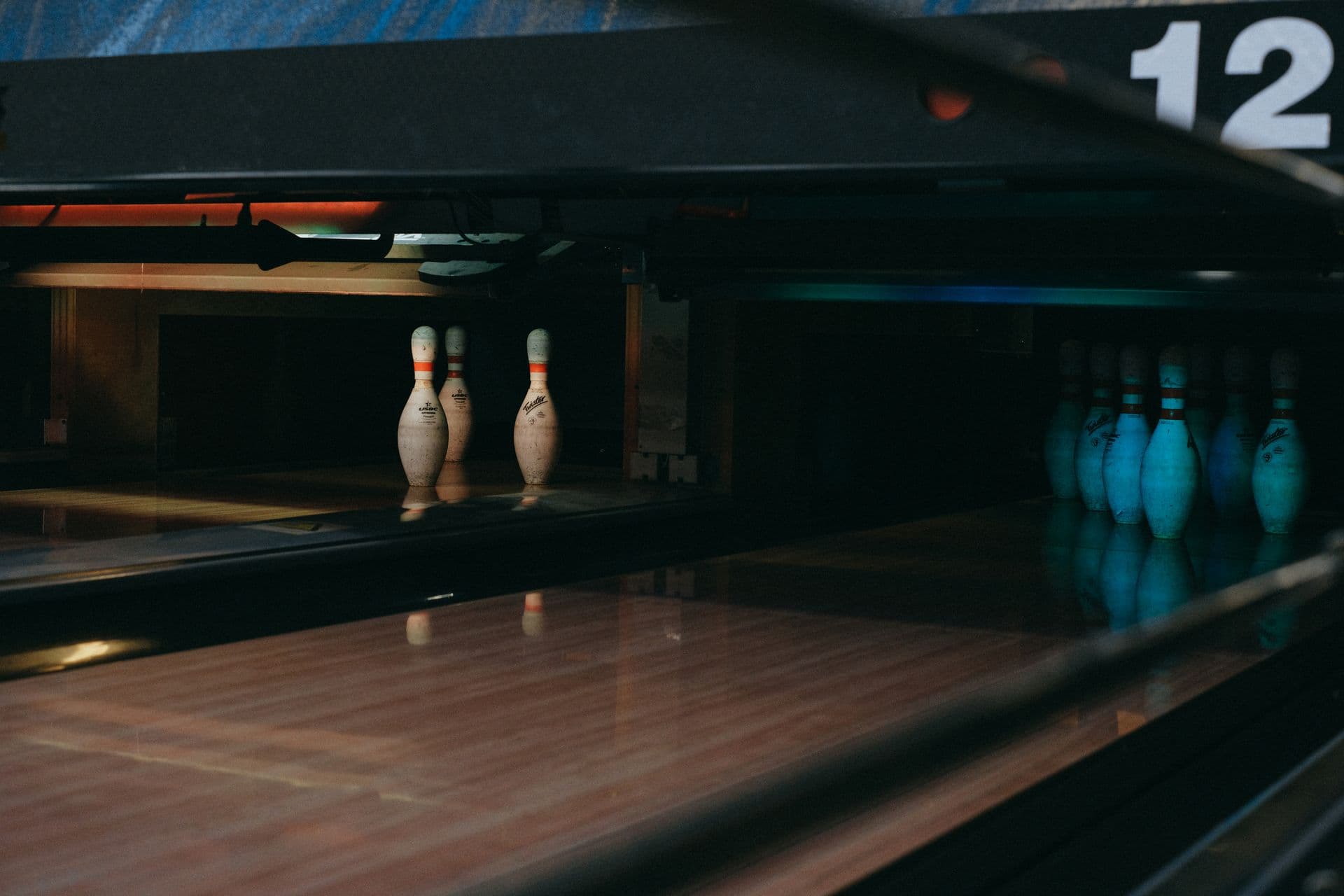 Nighttime bowling under neon lights