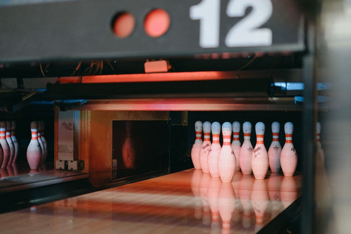 Bowling pins under dramatic lighting