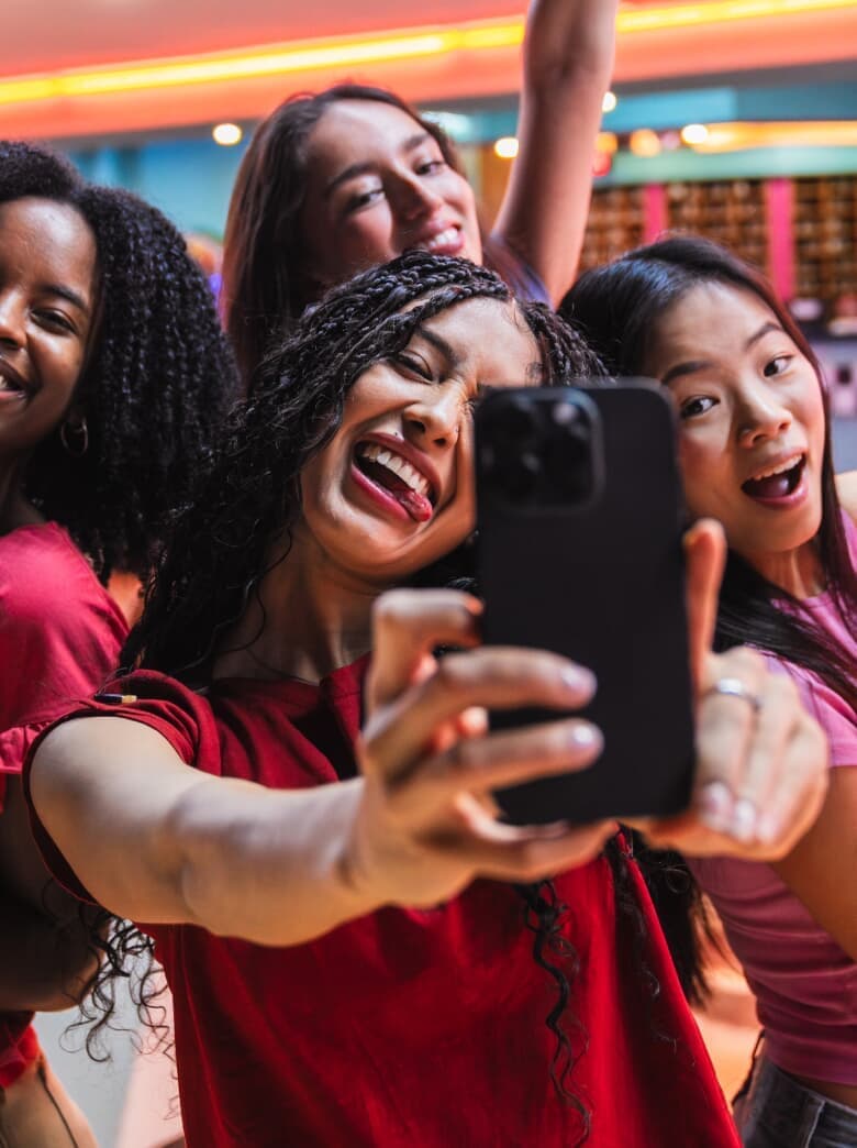 Friends taking a selfie at the alley
